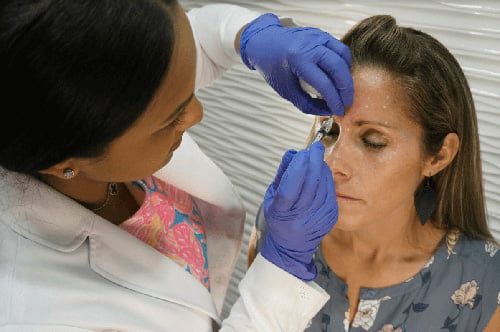 Dr. Rednam treating patient with Botox